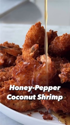 These Honey-Pepper Coconut Shrimp is perfectly paired with a mango-habanero aioli to dip ‘em in 😋. Get the recipe in the comments! 🎥: Chloe Gebacz | Food & Wine