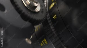 Close up of the lens with the Follow Focus motorized system. The process of adjusting focal length by using a professional wireless system for focus puller.