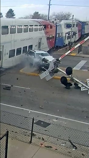 Driver jumps out of SUV moments before train crashes into it