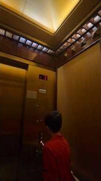 Golden Schindler elevator at Dillard's North East Mall in Hurst, Texas