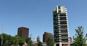 Afternoon sunlight shines on the historic buildings of the downtown skyline of Bartlesville, Oklahoma, USA.