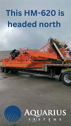 HM-620 Waterway Harvester on the Move – Orange Edition