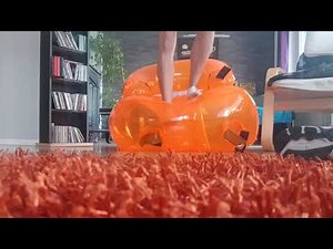 Looner, playing with an orange inflatable chair