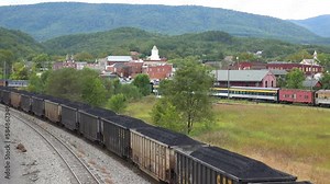 2022 - a long coal train rumbles through Virginia and West Virginia suggesting American coal towns.