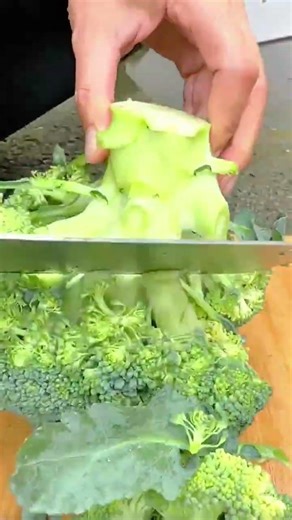 Preparing Fresh Broccoli Cutting Green Florets for Healthy Cooking