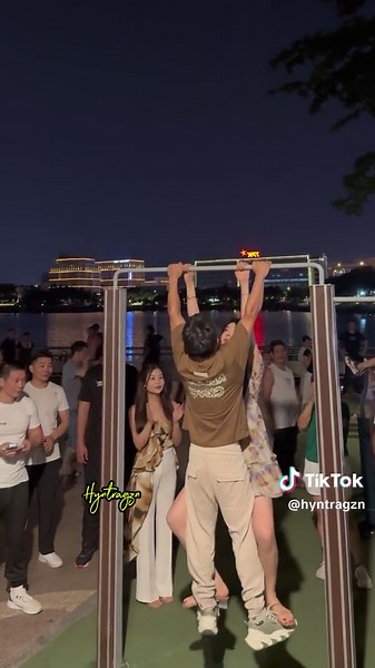 Couple's Playful Night Out at City Waterfront