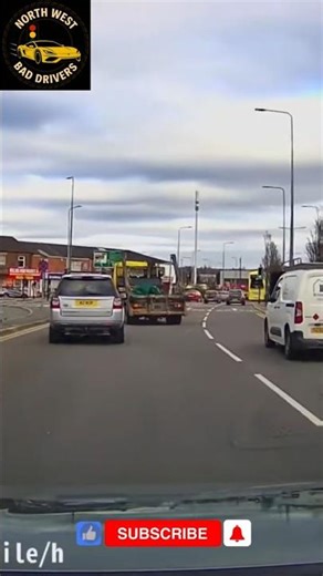 Reckless lorry cuts across multiple lanes to make a last second exit and cuts up other driver