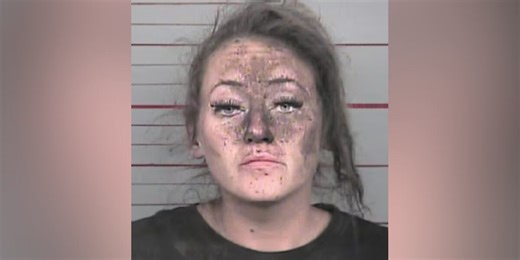 Woman arrested after first responders find her hiding inside the walls of a business, police say