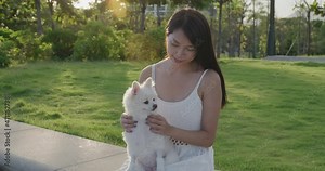 Woman play with her dog at park