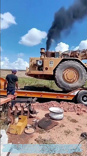 Precision Unloading: Masterful Scraper Driver Reverses From Truck