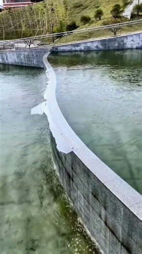 Mesmerizing Curved Water Weir Design