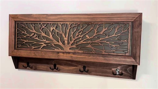 The Bellewood Designs Coat Rack Hidden Gun Storage - Tree of Life is a stunning combination of functional storage and elegant home décor. Crafted by hand in the U.S.A., this hidden gun cabinet features an intricate tree canopy design that blends beautifully with rustic or modern interiors. More than just a decorative piece, this coat rack provides a secure and discreet storage solution for your firearms and valuables. The magnetic lock system ensures quick yet safe access, while the customizable