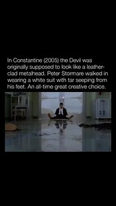 Explaining Films on Instagram: "Follow me 👉 @explainingfilms The creation of Constantine (2005) involved bold stylistic choices, including the depiction of the Devil. Originally envisioned as a leather-clad metalhead, the character was meant to embody a rebellious, rock-inspired aesthetic. This concept aimed to contrast the film’s dark, supernatural tone with a gritty, countercultural edge, reflecting the Devil’s chaotic nature. Director Francis Lawrence and the team sought a visually striking 