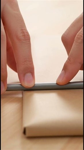 How to organize wrapping paper using a tension rod #Shorts