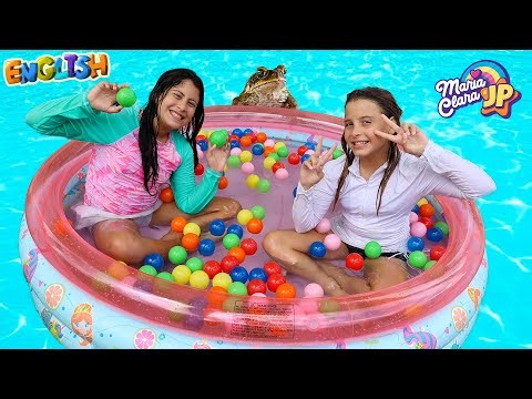 Maria Clara playing in the new plastic pool at the water park.