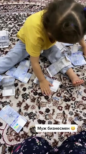 Counting Money: Child Engaged in Financial Play