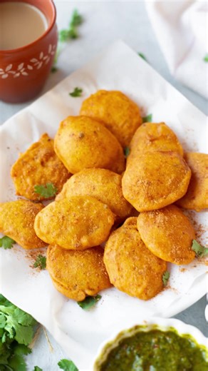 4.9K views · 71 reactions | These crispy potato fritters are made with sliced potatoes dipped in an earthy, spiced gram flour batter and fried until golden. Get the recipe at pipingpotcurry.com | Piping Pot Curry | Facebook