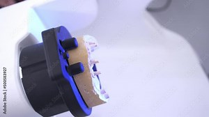 Denture base scanning. A medical device creates a digital 3D model of a human Jaw with a prosthesis by scanning