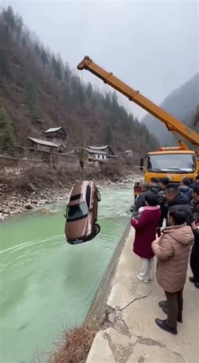 Crane Looses Footing And Ends Up In The River