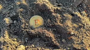 Bitcoin in soil after extraction. Сryptocurrency trading exchange. Bitcoin BTC mining, extraction. Bitcoin mining. Crypto capitalization growth. Bitcoin BTC coins mining in ground. Digger Dig a Crypto