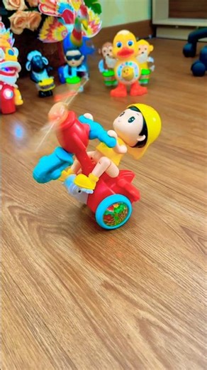 riding a red propeller bike