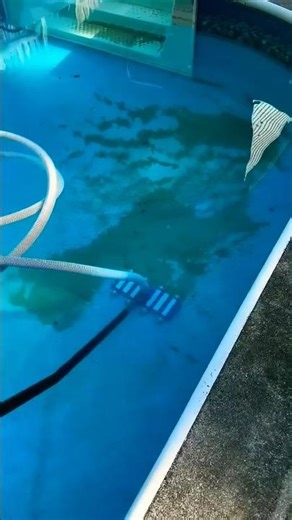 Vacuuming sand out of a swimming pool. //Pool Cleaning//Swimming pool//water cleaning