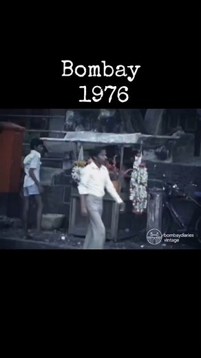 In 1976, Bombay was a bustling metropolis characterized by a blend of vibrant city life and moments of tranquility. The city was a hub of activity, with Bollywood's thriving film industry and a dynamic nightlife. Juhu Beach, for example, offered a more relaxed atmosphere where people enjoyed the sea breeze, street food, and camel rides. The city's streets were filled with the sounds of trams, black-and-yellow taxis, and bustling markets. Iconic landmarks like Marine Drive and the Gateway of Indi