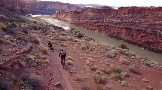 Mountain bikers ride the breathtaking Porcupine Rim Trail in Moab, Utah via Tec-GNAR Media. | Outside Watch