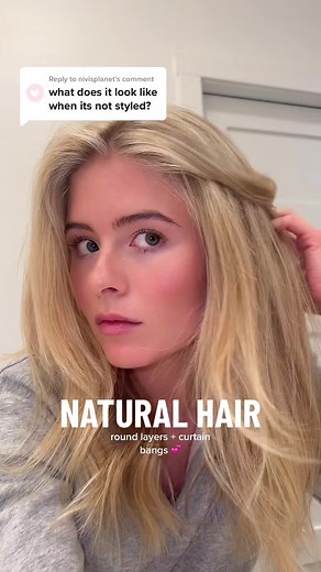 Natural Wavy Hair with Curtain Bangs: Unstyled Medium Length Look