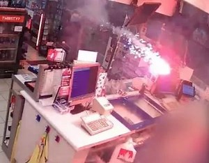 Laughing brutes pelt FIREWORKS at gas station clerk after taking selfies