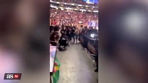 A woman tries to sneak into a UFC ring and what happens to her is karma at its finest