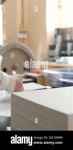 Print operator pulls printed sheet of paper, polygraphic process Stock Video Footage - Alamy