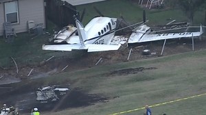 Shock pics show fiery plane crash after aircraft slammed into ground near homes