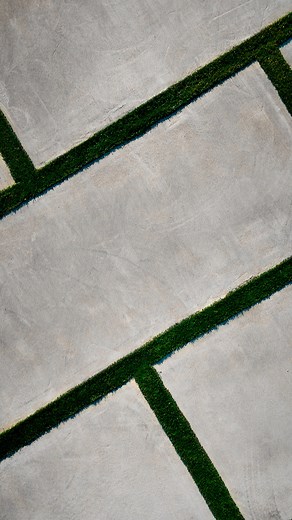 Your driveway sets the tone for your entire home. ✨ This modern concrete and turf design adds space, elegance, and definition, turning a simple entrance into a statement.  The question is… is your home ready to welcome guests this holiday season?  Get your free estimate today.  | IBP Outdoor Living | Facebook