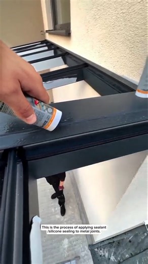 Precision Metal Beam Waterproofing Using a Caulking Gun – Construction Detail Close-Up