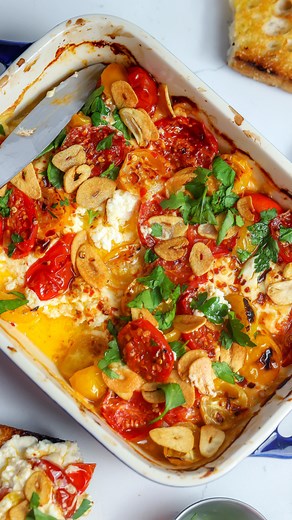 Baked Goat Cheese, Garlic Chips & Tomatoes… Ingredients: •8 oz goat cheese (sliced). •1 pint cherry tomatoes (sliced in half). •1.5 tbsp olive oil. •1 tbsp honey. •1 tbsp crushed red peppers. •3 garlic cloves (thinly sliced). •parsley to taste. •salt and pepper to taste. Directions: 1. Arrange the goat cheese in a baking dish and top with the tomatoes. 2. Add the olive oil, honey, crushed red peppers and a bit of salt. 3. Bake at 400F for 25-30 min. 4. Slice the garlic really thin. Preheat a pan