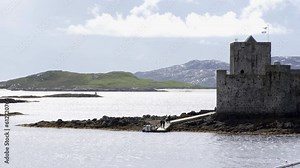 Static shot of tourists disembarking their boat to Kisimul Castle in Castlebay. Filmed on the Isle of Barra, part of the Outer Hebrides.