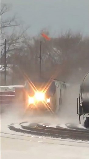 Fast Amtrak Train Passes Slow Freight Train