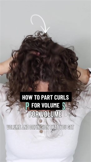 The full video routine is linked in my profile along with the brush, clips, and diffuser 🔗 Here's how I like to part my curls: 1. Split my top section of hair in half with clean lines. 2. Using a brush, direct the hair around the crown up and back 3. Brush the front section straight up and allow the curls to separate where they naturally want to group. I make a part about 1-2 inches long. 4. Brush style the front section taking vertical pieces and wrapping them around the brush handle close to