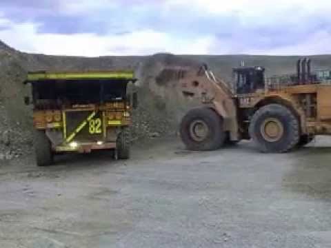 CAT 994 world's largest diesel front end loader loading a CAT 793