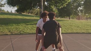 Friends Playing Basketball at an Outdoor Court