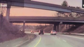 Frightening Moment Lumber Truck Loses Load, Sending Material Smashing Into Car