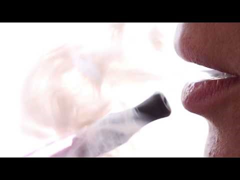 Female Smoking an Electronic Vape Pen | Stock Video of Female Vaping | 25fps HD 1080p