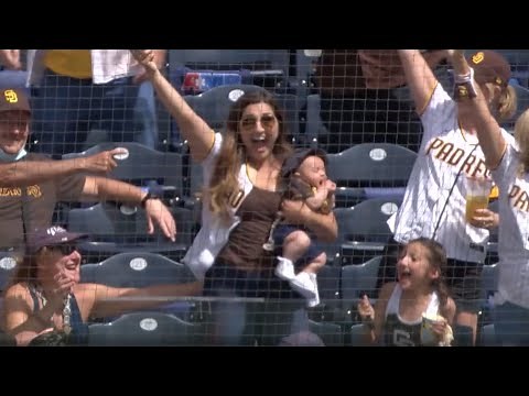 Mom catches foul ball WHILE HOLDING BABY!