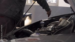 industrial video shot, Hands-On Repair, Close-Up of a Mechanic at Work, Precision Repair, A Close-Up of a Mechanic Fixing a Car