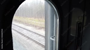 railway passenger and freight train on the way view from the rear window