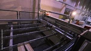 Transportation of logs, truck with logs, red truck carrying logs at a sawmill