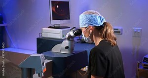 Young patient woman having an eye exam performed by the optometrist doctor at ophthalmologist's medical clinic before the surgery in Los Angeles, California, 4K