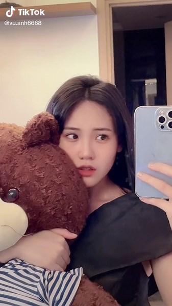 Cuddling a Giant Teddy Bear: A Sweet Moment