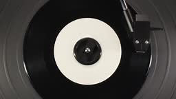 Retro Vinyl record player playing music, close-up macro shot of...